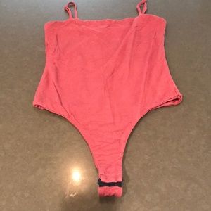 Red thong body suit